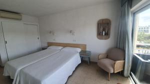 Postel nebo postele na pokoji v ubytování Hostal Roberto