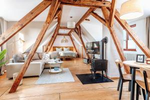 a living room with a couch and a table at Apartments Kassebohmer Weg in Rostock