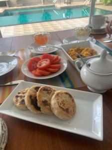 a plate of food with bread and vegetables on a table at Anveela in Beruwala