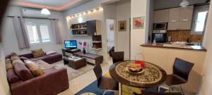 A kitchen or kitchenette at Flora's Boutique Apartment at the heart of Corfu
