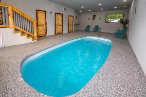 a large blue swimming pool in a room at Morning View in Sevierville