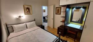 A bed or beds in a room at Flora's Boutique Apartment at the heart of Corfu