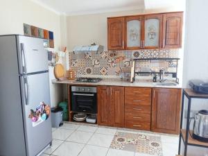 Kuchyň nebo kuchyňský kout v ubytování Bel appartement refait à neuf Bahia Smir