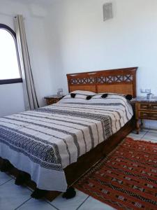 Postel nebo postele na pokoji v ubytování Bel appartement refait à neuf Bahia Smir
