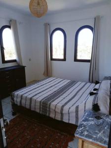 Postel nebo postele na pokoji v ubytování Bel appartement refait à neuf Bahia Smir