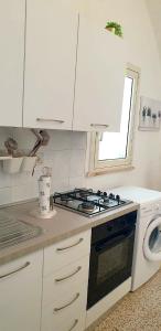 A kitchen or kitchenette at CASA VACANZE PIAZZA MALTA