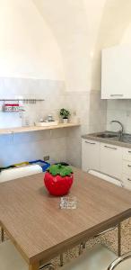 A kitchen or kitchenette at CASA VACANZE PIAZZA MALTA
