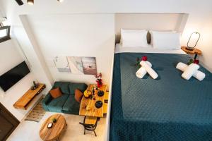 an overhead view of a bedroom with a bed and a table at Ontas apartment in Kissamos in Kissamos