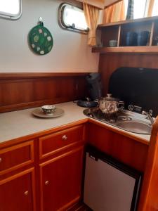 a kitchen with a stove and a sink at Motor Yacht Amazone in Amsterdam