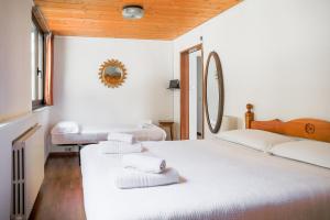 Postel nebo postele na pokoji v ubytování Lucio&Pina house