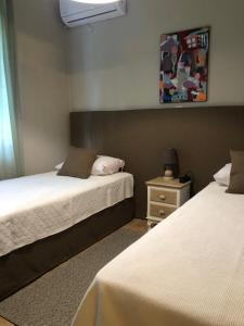 A bed or beds in a room at Hospitality M7