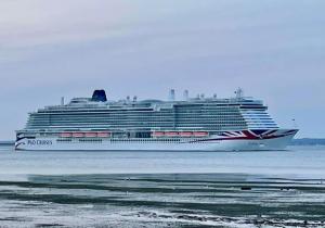 a cruise ship sitting in the ocean with at The Lantern Building in Southampton