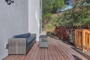 a patio with a couch and a table on a deck at Near Downtown l Peaceful l Modern l Kids Room in Atascadero
