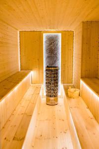 an inside of a wooden sauna with two beds at Pensjonat Laworta Ski in Ustrzyki Dolne