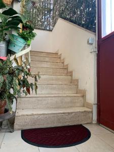 a set of stairs in a room with plants at Mariluna in Modugno