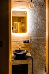 a bathroom with a sink and a mirror at Pensjonat Laworta Ski in Ustrzyki Dolne