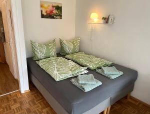 מיטה או מיטות בחדר ב-Ferienwohnung Sonnenschein