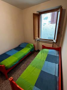 Ein Bett oder Betten in einem Zimmer der Unterkunft Casa Piglione