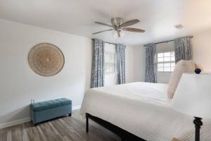 a bedroom with a bed and a ceiling fan at Trout Bayou 2BR/2BT Canal in Milton