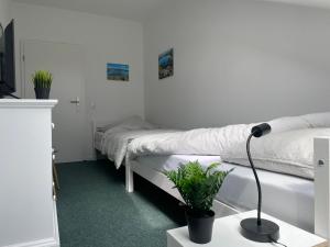 Postel nebo postele na pokoji v ubytování Traumhaus am Wald 2