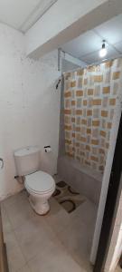 a bathroom with a toilet in a room at Bellos Milagros in Santa María
