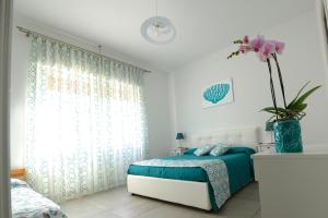 Posteľ alebo postele v izbe v ubytovaní B&B Marina House Porto Ercole