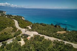 an aerial view of a road and the ocean at Pelagaki Sunrise in Orthoniaí