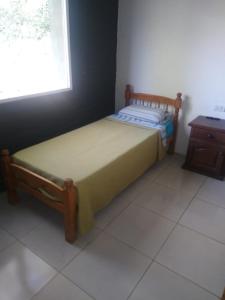 Tempat tidur dalam kamar di Casa de campo Los Cardenales