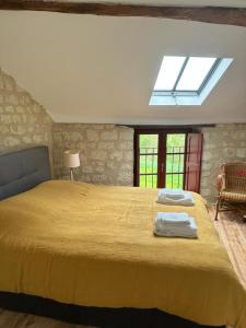 Posteľ alebo postele v izbe v ubytovaní Gîte de Frau
