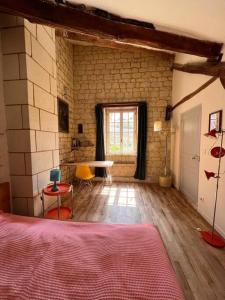 Posteľ alebo postele v izbe v ubytovaní Gîte de Frau
