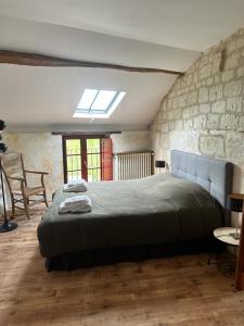 Posteľ alebo postele v izbe v ubytovaní Gîte de Frau