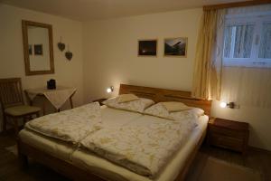 Posteľ alebo postele v izbe v ubytovaní Ferienwohnung Dolomitenheim