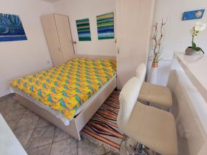 Łóżko lub łóżka w pokoju w obiekcie Apartments Lana