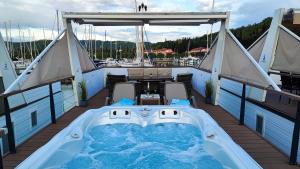 a hot tub on the deck of a boat at SEA LUX FLOATING HOUSE AJDA Portorose in Portorož