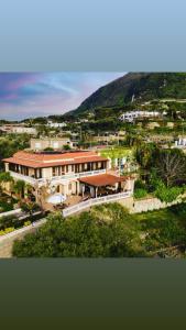 an aerial view of a building with a mountain at Villa Antonietta Ischia in Ischia