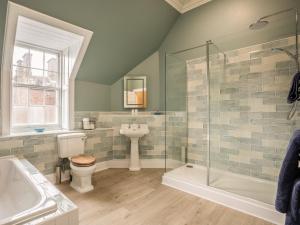 a bathroom with a sink toilet and a shower at Glen Apartment - Uk43813 in Ardovie