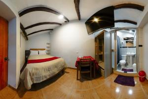Postel nebo postele na pokoji v ubytování Cochito Cusco