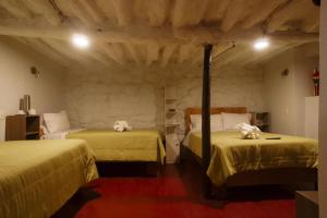 Postel nebo postele na pokoji v ubytování Cochito Cusco