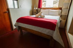 Postel nebo postele na pokoji v ubytování Cochito Cusco