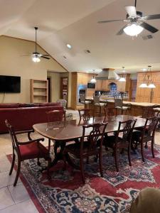a living room with tables and chairs and a kitchen at Oxford Chalet Getaway with Lake/Beach Access in Oxford