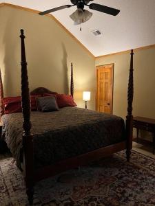 a bedroom with a bed and a ceiling fan at Oxford Chalet Getaway with Lake/Beach Access in Oxford +46 photos