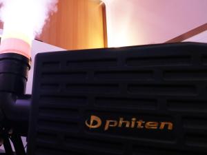 a close up of a smoking gun next to a television at First Cabin Nishi Umeda in Osaka