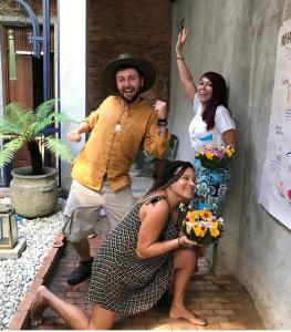 a group of three people posing for a picture at Khunluang Hostel in Chiang Mai