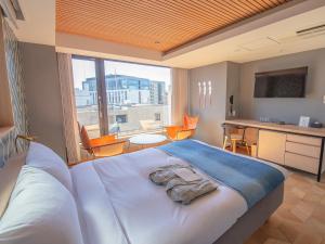 Rúm í herbergi á Asakusa Kokono Club Hotel