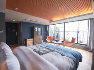 Rúm í herbergi á Asakusa Kokono Club Hotel
