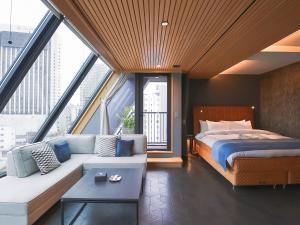 Rúm í herbergi á Asakusa Kokono Club Hotel