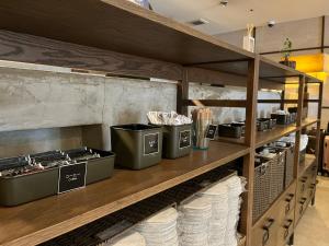 a kitchen with a counter with food items on it at Plaza Hotel Tenjin in Fukuoka