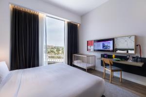 Postel nebo postele na pokoji v ubytování Ink Hotel