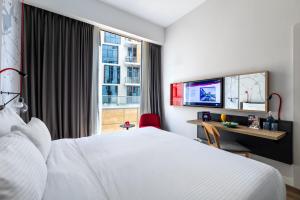 Postel nebo postele na pokoji v ubytování Ink Hotel