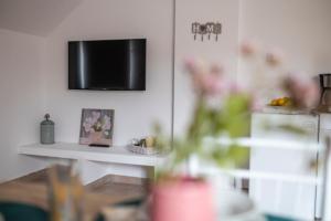 A television and/or entertainment centre at traditional suburbs maisonette